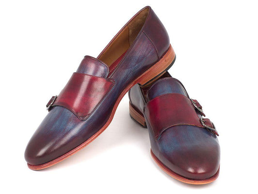 The Paul Parkman Bordeaux & Navy Double Monkstrap Shoes (model HR65CX) are a pair of handcrafted leather shoes, featuring hand-painted calfskin with wooden soles and decorative buckles.