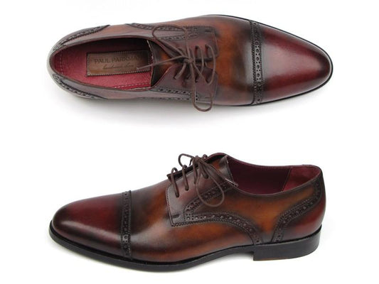A pair of Paul Parkman Bordeaux & Tobacco Derby Shoes, expertly crafted in men's Italian calfskin leather with intricate brogue detailing. One shoe is elegantly displayed from the side and the other from above, highlighting their exceptional craftsmanship.