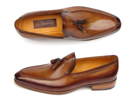 The Paul Parkman Tassel Loafer Camel & Brown Hand-Painted - 083-CML features a refined leather design with one shoe showcased from the side and the other from above, highlighting the distinctive "Paul Parkman" label inside. These men's shoes are ideal for those who value exceptional craftsmanship and style.