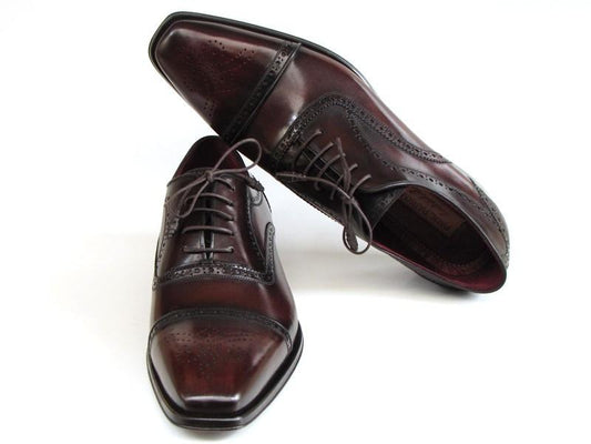 The Paul Parkman Captoe Oxfords Bordeaux & Brown Hand-Painted - 024-BRWBRD are a pair of men's dress shoes by Paul Parkman, made from Italian calfskin with intricate brogue detailing and laces. The elegantly hand-painted rich brown leather adds a touch of sophistication to these classic shoes, which stand out against a white background.