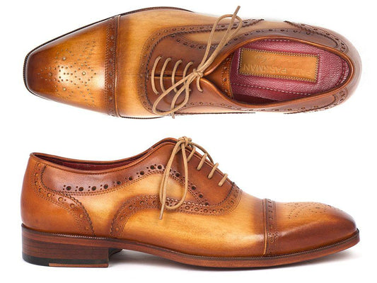 Introducing the Paul Parkman Captoe Oxfords Tan - 024-TAN, a pair of expertly hand-painted leather brogue shoes in a classic tan hue. Featuring perforated detailing and laces, this stylish footwear from Paul Parkman exudes the charm of an Oxford style, with both the top and side views highlighting its exquisite craftsmanship.