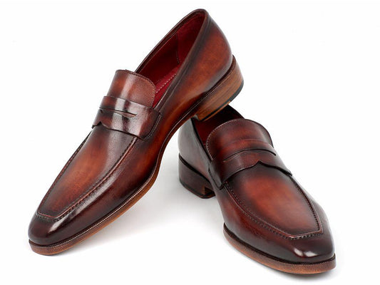 The Paul Parkman Penny Loafer Bordeaux and Brown Calfskin - 10FD61 showcases a sleek design and low heel, crafted from brown, hand-painted leather with a polished finish, set against a white background.