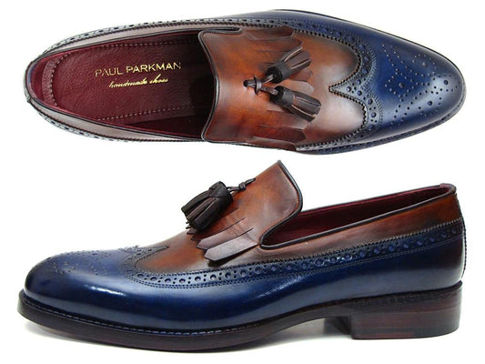 The Paul Parkman Kiltie Tassel Loafer Navy & Tobacco - KT74NB features two-tone navy and tobacco leather with wingtip and brogue detailing, expertly crafted in hand-painted calfskin. Displayed from side and top views, the brand name Paul Parkman is visible inside these made-to-order shoes.