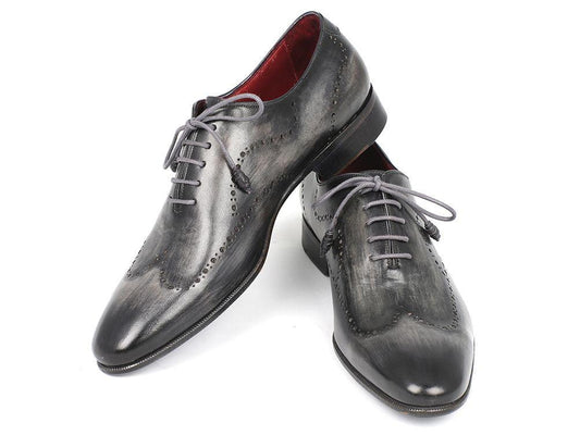 Paul Parkman Wingtip Oxfords Gray & Black Handpainted Calfskin - 741-GRY by Paul Parkman are showcased on a white background, featuring polished dark gray hues and crafted with hand-painted calfskin, decorative perforations, and laces.