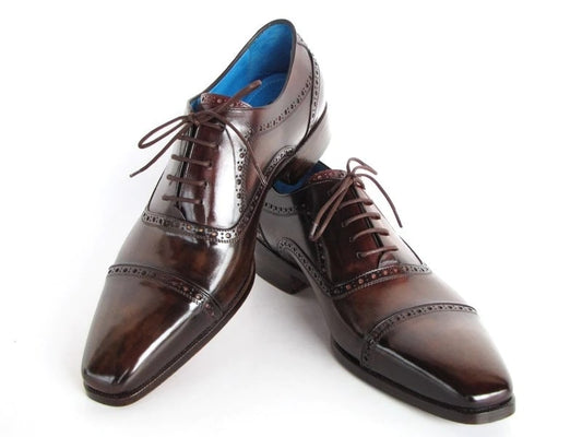 The Paul Parkman Captoe Oxfords in anthracite brown, hand-painted Italian leather, showcase decorative perforations and lace-up design, presented on a white background.