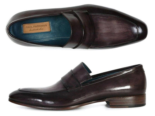 The Paul Parkman Loafer, a sophisticated slip-on shoe for men, showcases a black and gray hand-painted leather exterior in a penny slot design, visible from both side and top angles. The rich texture of the leather complements the brown sole with a subtle heel. Inside, the Paul Parkman brand label emphasizes the craftsmanship of these bespoke classics.