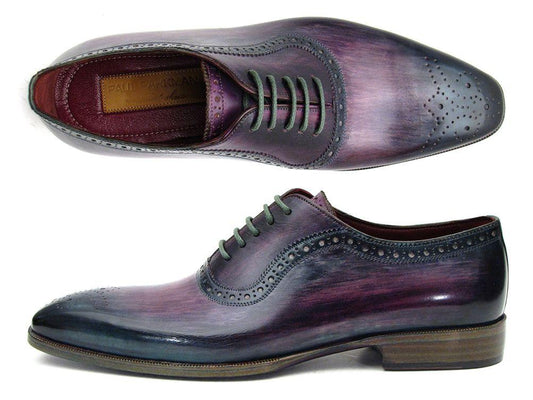Introducing the Paul Parkman Purple & Navy Medallion Toe Oxfords - PR88TT, an elegant pair of handmade shoes. Showcasing a sophisticated interplay of purple and black hues, these dress shoes feature decorative perforations complemented by brown soles. Expertly crafted from hand-painted leather by Paul Parkman, they offer a distinctive touch for the discerning dresser.