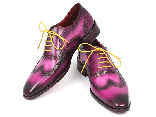 The Paul Parkman Wingtip Oxfords Lilac Handpainted Calfskin - 228-LIL feature a meticulous hand-painted lilac gradient leather with yellow laces and intricate brogue detailing in a timeless wingtip oxford design.