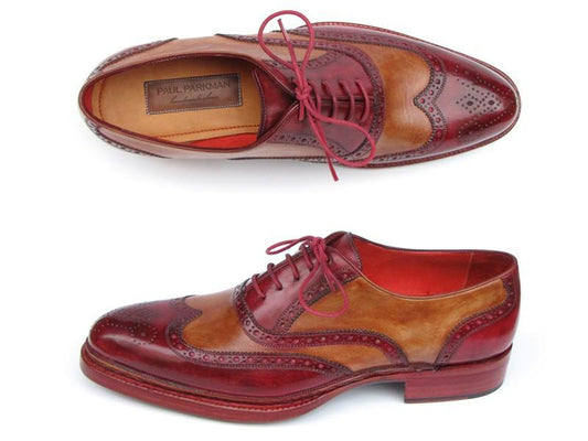 Introducing the Paul Parkman Triple Leather Sole Wingtip Brogues in Bordeaux & Camel, model 027-TRP-CMLBRD. These men's oxfords from the esteemed brand Paul Parkman are crafted with hand-painted leather in a stunning red and brown combination. They showcase decorative perforations, vibrant red laces, and offer excellent durability thanks to their Goodyear welted construction. View these exquisite shoes from the top and side angles for a complete appreciation of their design.