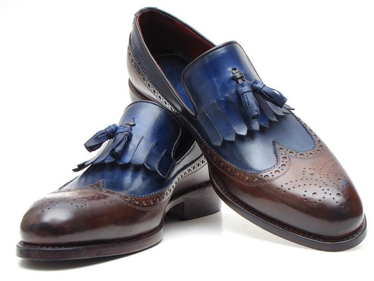 Discover the Paul Parkman Kiltie Tassel Loafer in Dark Brown & Navy (KT44BN), featuring a sophisticated two-tone design. Crafted from handpainted calfskin leather, these men's dress shoes are embellished with Kiltie style tassels and intricate brogue detailing on the toe cap, delivering a timeless blend of classic elegance in a made-to-order product.