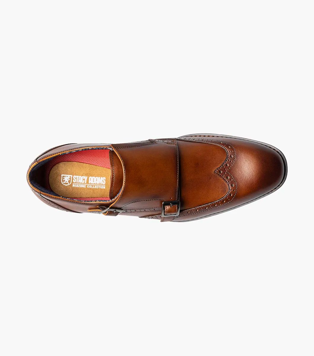 The STACY ADAMS Karson Wingtip Double Monk Strap dress shoe in Cognac features decorative perforations and a low heel, shown on a white background. Model: 25570-221.