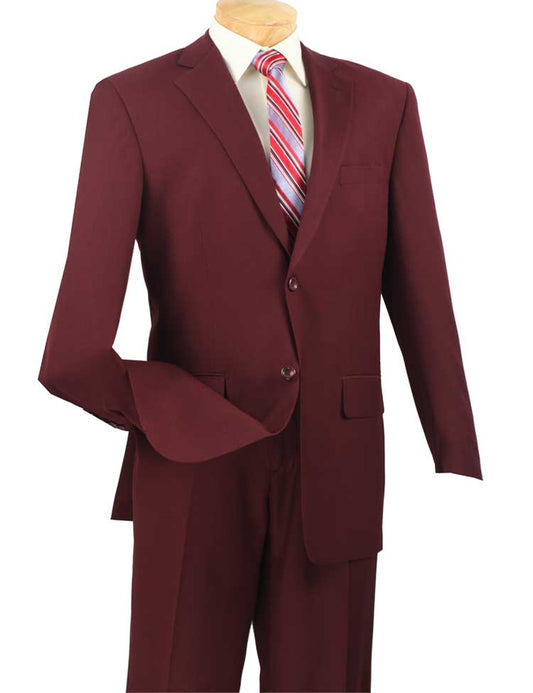 The Vinci Suits' Regular Fit 2 Piece Burgundy Suit (2LK-1) features a notch lapel and flat front pants, paired with a white shirt and red striped tie, all elegantly displayed on a wooden mannequin.