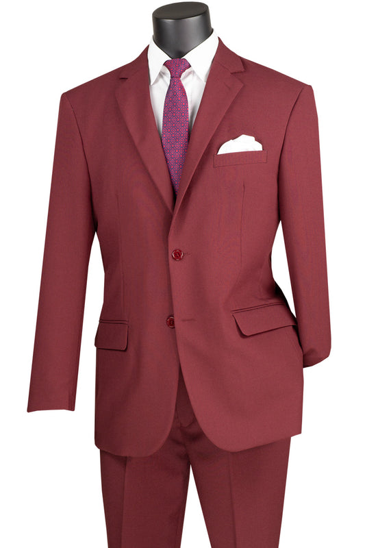 A burgundy Vinci Suits Single Breasted Poplin Dacron Suit on a mannequin shows off flat front pants and a single-breasted jacket with side vents, paired with a crisp white shirt, a purple tie, and a pristine white pocket square.