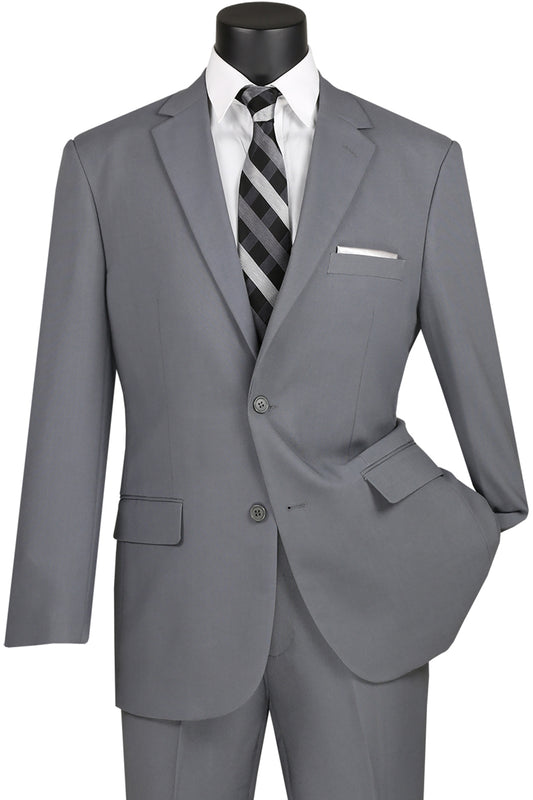 On a mannequin, the Vinci Suits Single Breasted Poplin Dacron Suit in Medium Gray features a jacket with side vents, a pocket square, and matching flat front pants, paired with a white shirt and black and gray striped tie.