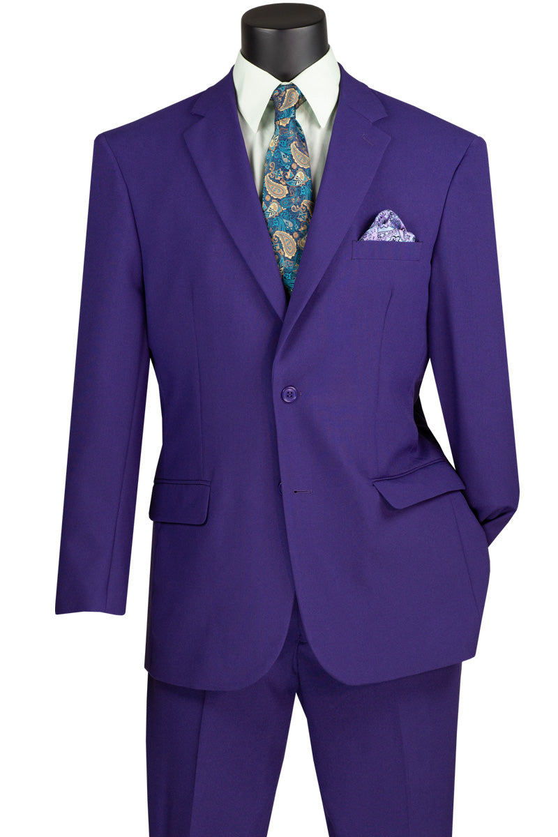 A mannequin features the Vinci Suits Single Breasted Poplin Dacron Suit in purple, paired with flat front pants, a patterned blue tie, and a matching pocket square.