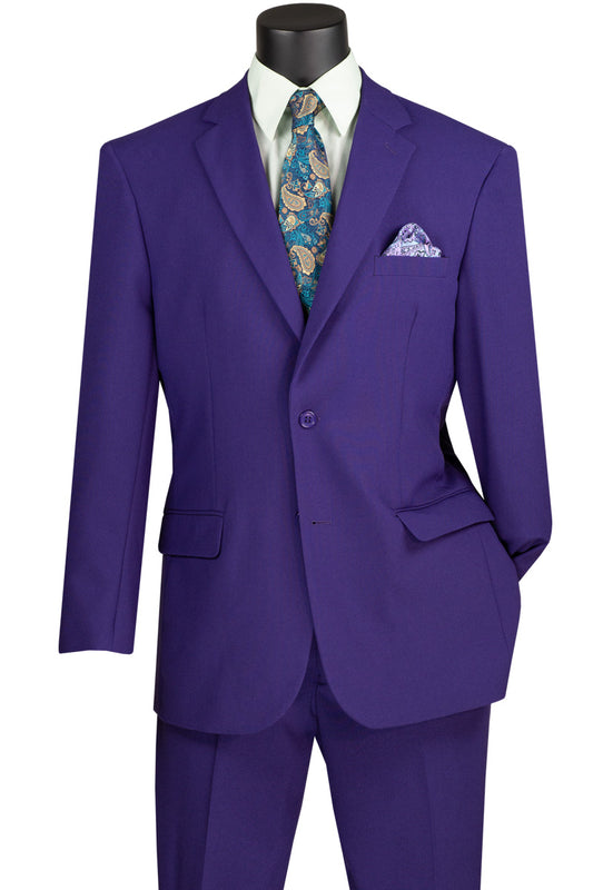 A mannequin features the Vinci Suits Single Breasted Poplin Dacron Suit in purple, paired with flat front pants, a patterned blue tie, and a matching pocket square.