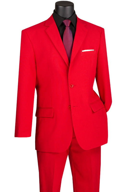 The mannequin elegantly displays the Vinci Suits Single Breasted Poplin Dacron Suit in red, featuring flat front pants, a black shirt, red tie, and white pocket square. The ensemble is perfected with a timeless 2-button jacket.