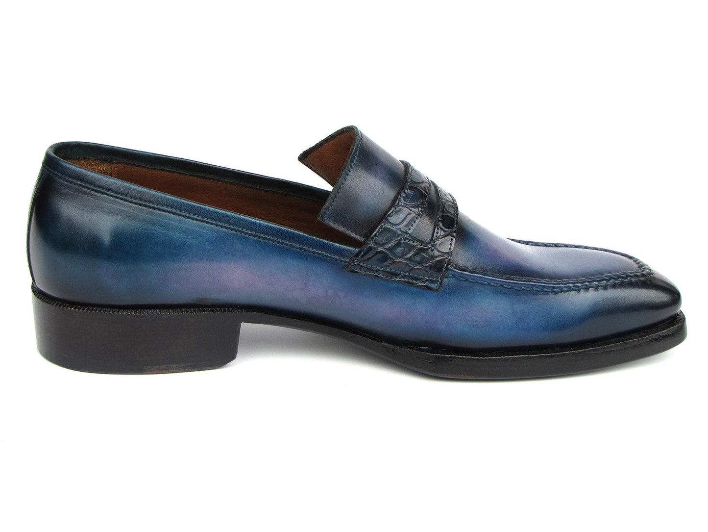 The Paul Parkman Men's Blue Patina Handmade Loafers (model 6944-BLU) feature a stunning design with a dark geometric strap detail and a subtle gradient. These loafers are crafted from hand-painted leather, constructed using the Goodyear welted method for exceptional quality and durability, complete with robust black soles.