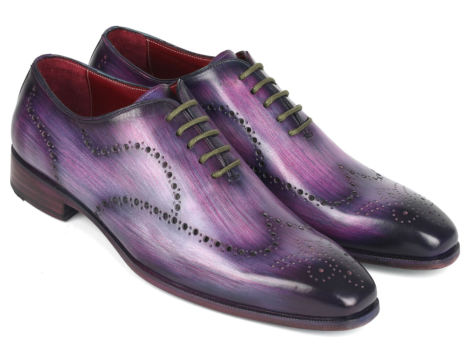 The Paul Parkman Men's Wingtip Oxfords in Purple (741-PUR), crafted to order with decorative perforations and dark laces, elegantly showcase their wingtip design against a white background.