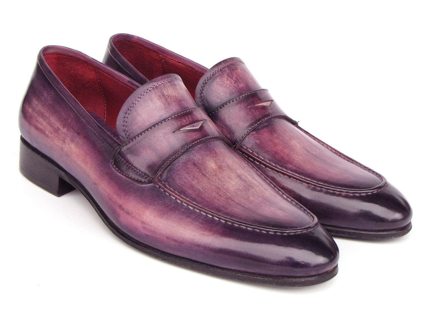 A pair of Paul Parkman Men's Purple Patina Penny Loafers - 17PRP33, crafted from hand-painted leather with a strap across the front, displayed on a white background.