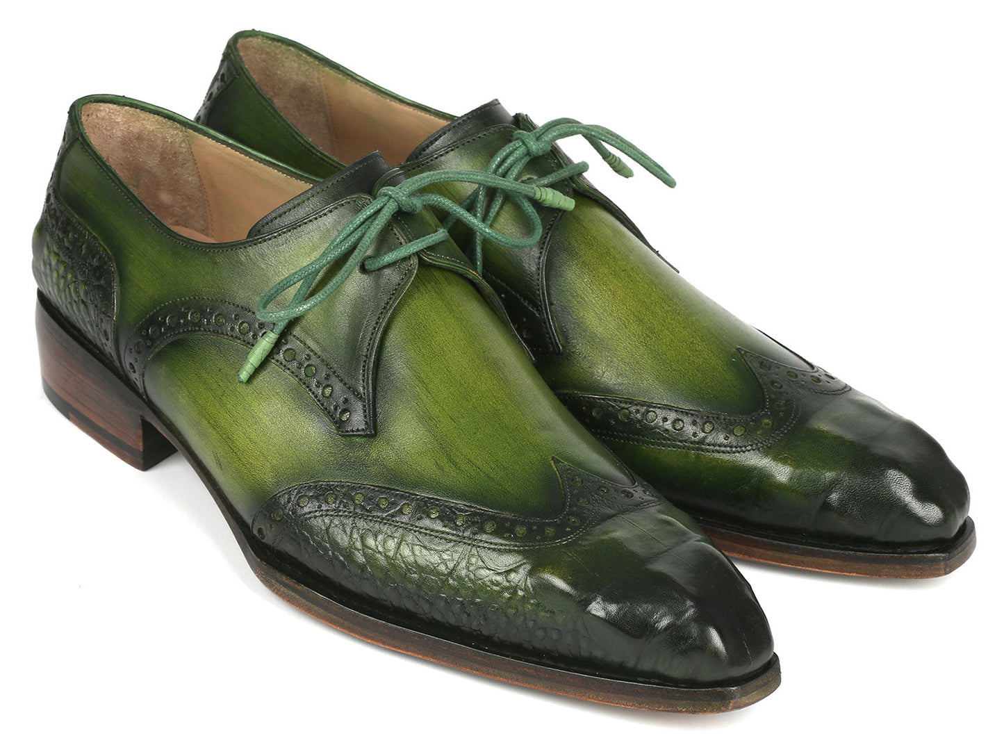 The Paul Parkman Goodyear Welted Wingtip Derby Shoes in Green, model 584-GRN by Paul Parkman, are featured against a white background. These handcrafted shoes, adorned with decorative perforations and laces, combine style and durability as an elegant made-to-order product.
