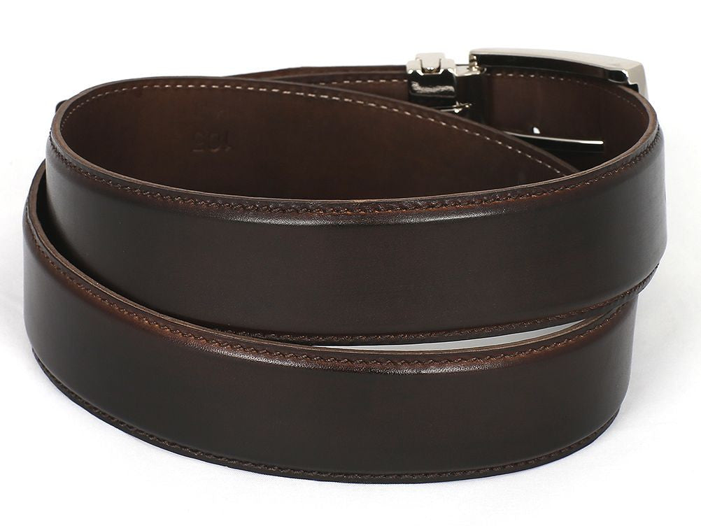 The Paul Parkman Leather Belt Hand-Painted Dark Brown B01-DARK-BRW, featuring a rolled-up design with a silver buckle, is perfect for those who appreciate quality craftsmanship.