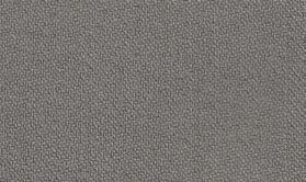 A close-up of a textured gray surface mimics the tightly woven, uniform appearance typical of Inserch's Regular Fit Two Pleat T/R Pant P1199S-33 Grey, reminiscent of trousers crafted from a durable poly-rayon blend.