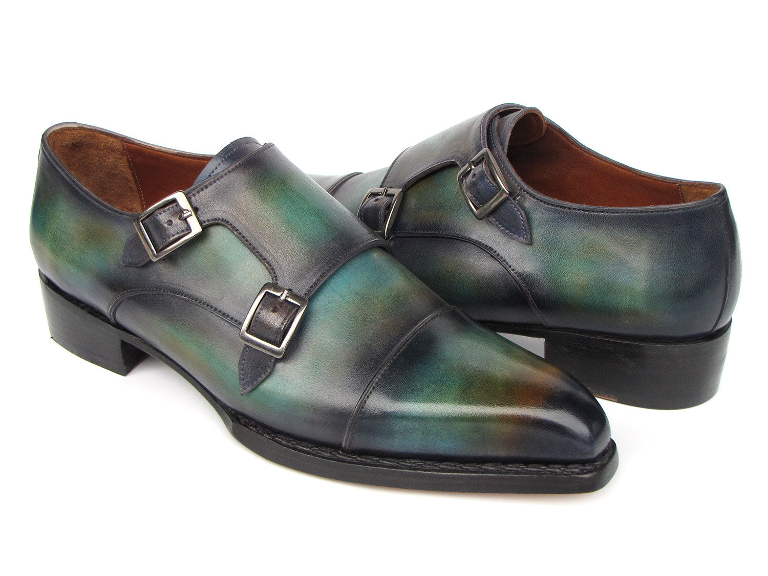 Introducing the Paul Parkman Men's Cap Toe Double Monkstrap Shoes in Green & Blue Patina (model 2598-5BG), these exquisite shoes are crafted from hand-painted leather, showcasing a striking gradient of green and blue hues. As a made-to-order product, they promise both unique style and perfect fit.