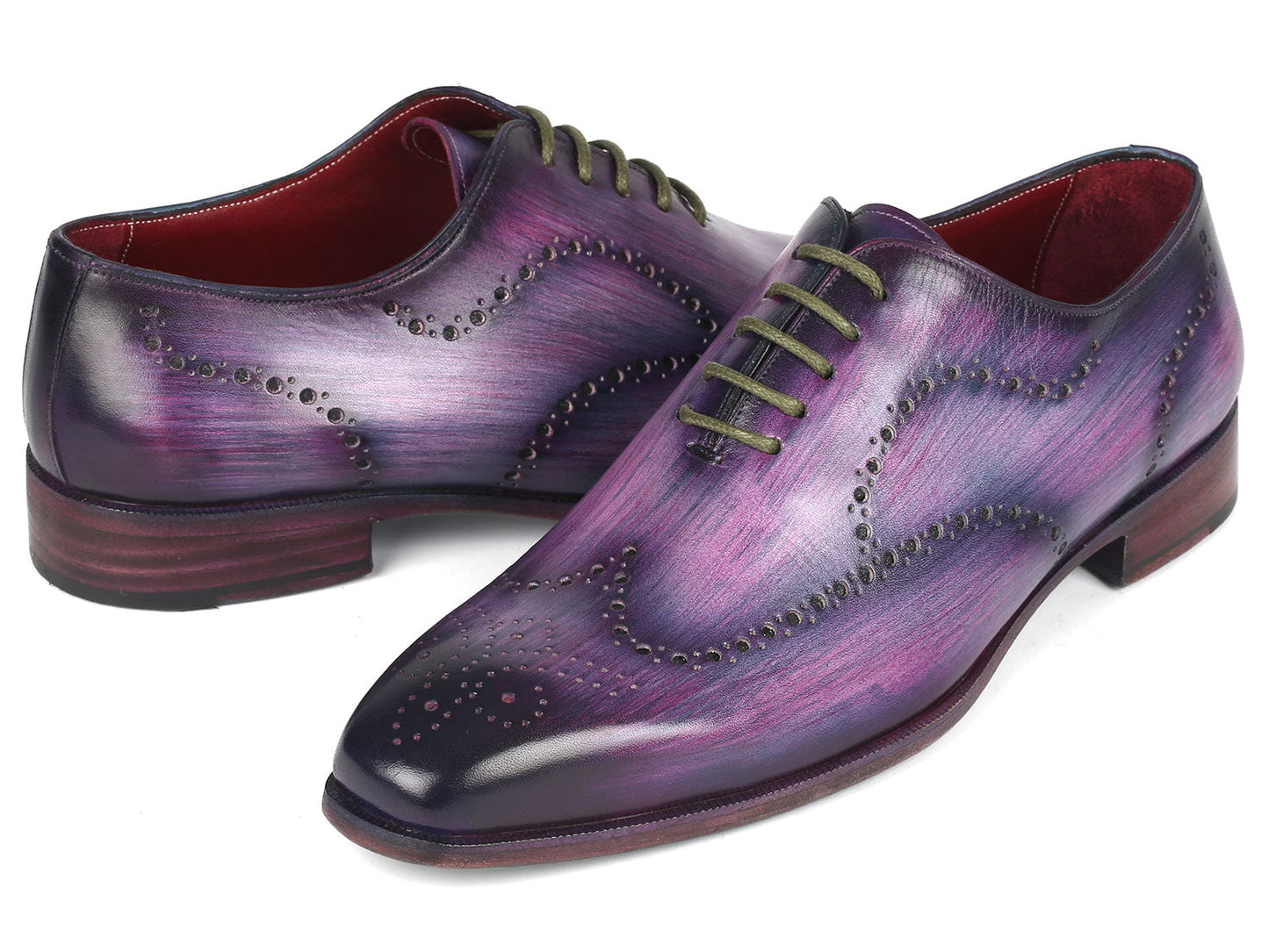 The Paul Parkman Men's Wingtip Oxfords in Purple (741-PUR), crafted to order with decorative perforations and dark laces, elegantly showcase their wingtip design against a white background.
