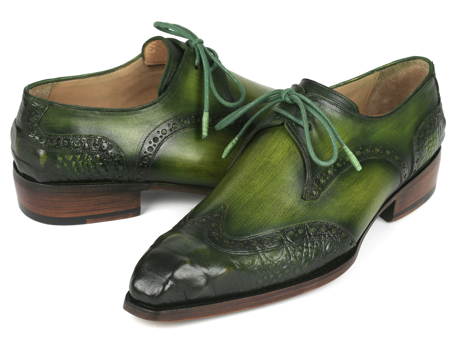The Paul Parkman Goodyear Welted Wingtip Derby Shoes in Green, model 584-GRN by Paul Parkman, are featured against a white background. These handcrafted shoes, adorned with decorative perforations and laces, combine style and durability as an elegant made-to-order product.