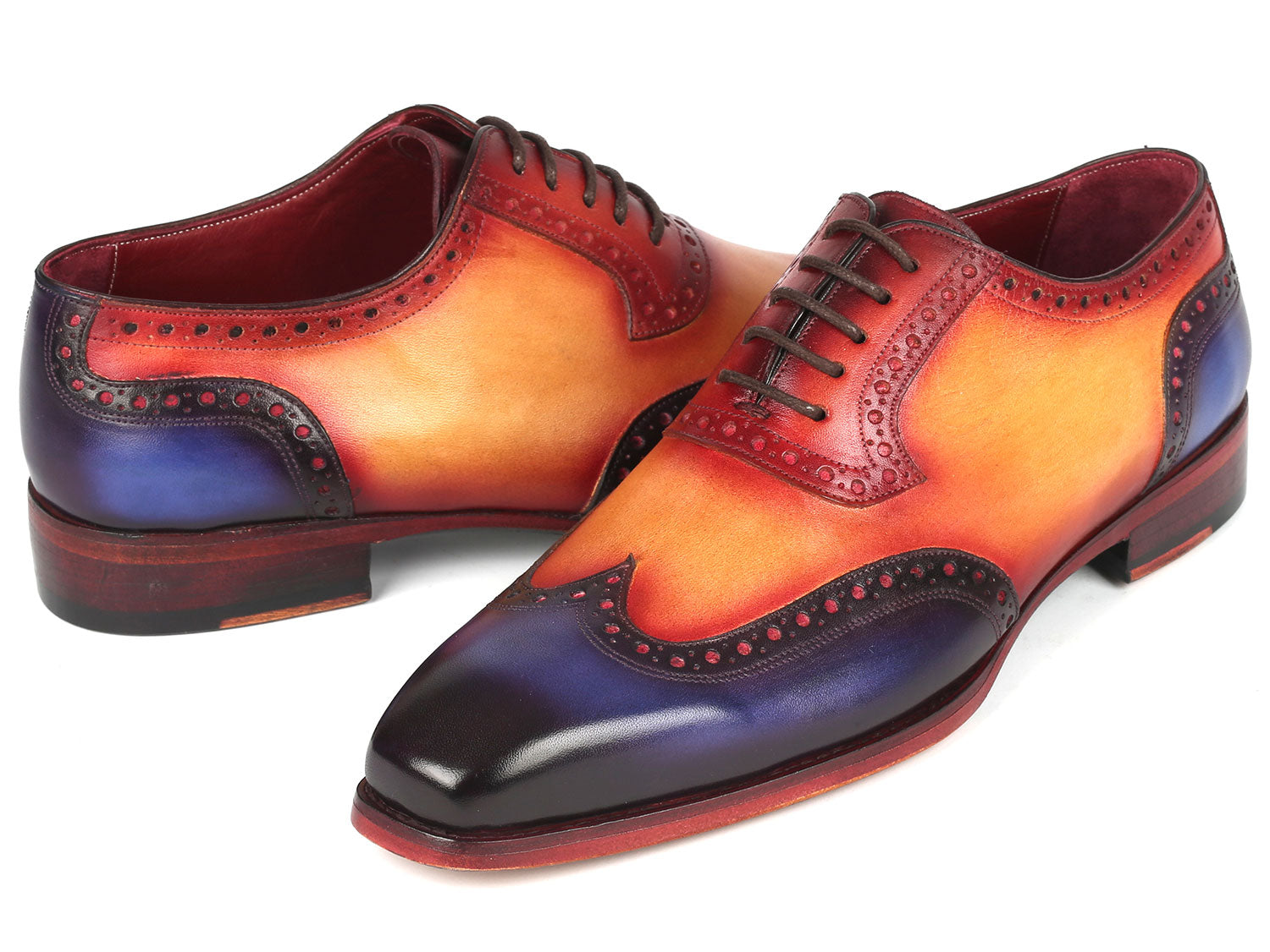 The Paul Parkman Goodyear Welted Men's Wingtip Oxfords Multicolor - 6819-MLT feature a handcrafted design with ombre colors of red, orange, and purple, wingtip oxford brogue detailing, and black laces.