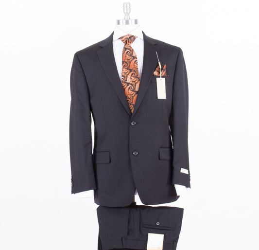 The MICHAEL KORS Modern Fit Black KEVI2K2Z1168 suit is showcased on a mannequin, featuring a paisley orange tie and pocket square. A crisp white shirt peeks through, with tags still attached. Matching black pants are displayed below, completing this modern fit suit ensemble.