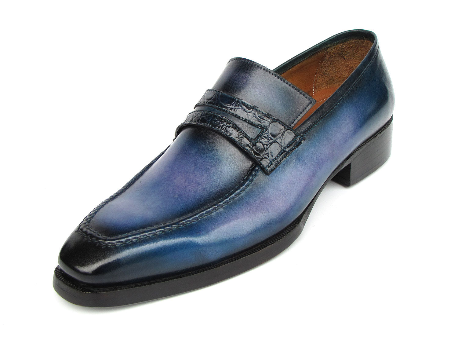 The Paul Parkman Men's Blue Patina Handmade Loafers (model 6944-BLU) feature a stunning design with a dark geometric strap detail and a subtle gradient. These loafers are crafted from hand-painted leather, constructed using the Goodyear welted method for exceptional quality and durability, complete with robust black soles.