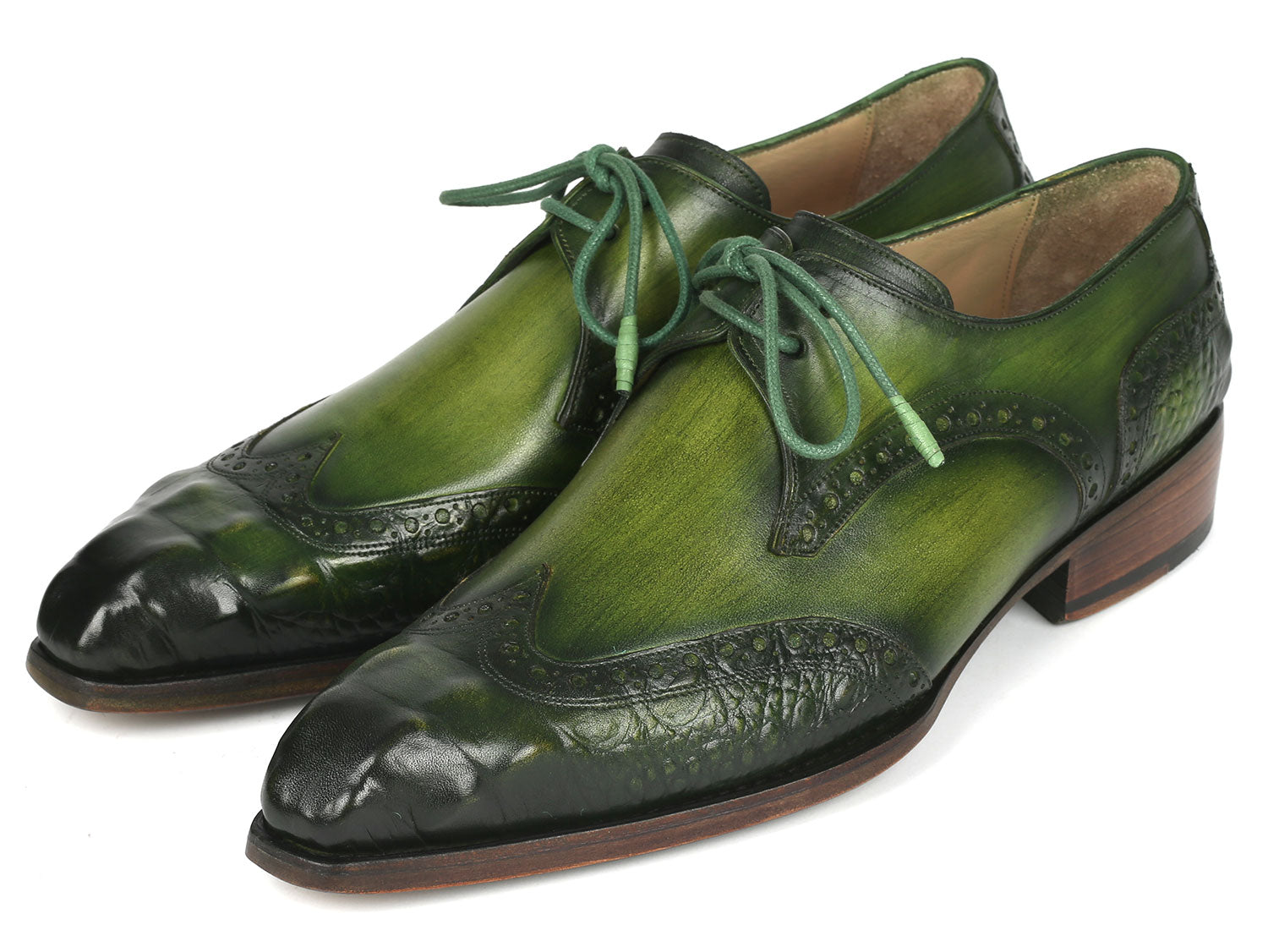The Paul Parkman Goodyear Welted Wingtip Derby Shoes in Green, model 584-GRN by Paul Parkman, are featured against a white background. These handcrafted shoes, adorned with decorative perforations and laces, combine style and durability as an elegant made-to-order product.