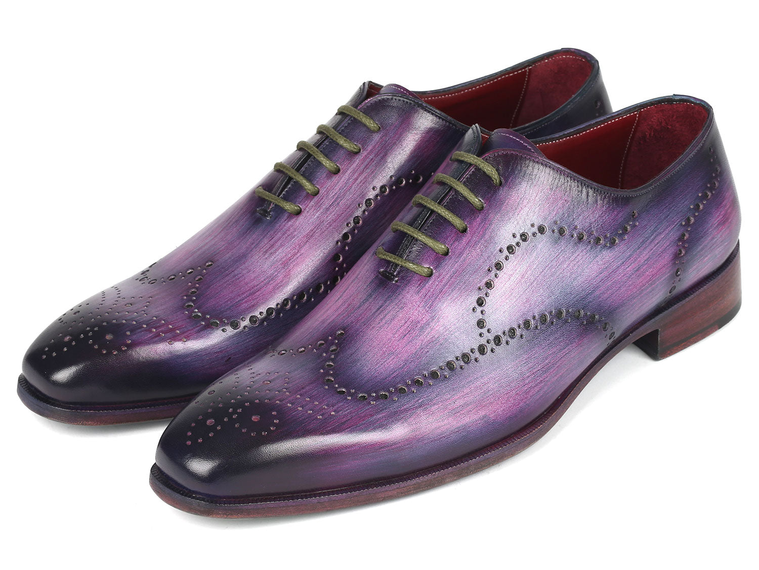 The Paul Parkman Men's Wingtip Oxfords in Purple (741-PUR), crafted to order with decorative perforations and dark laces, elegantly showcase their wingtip design against a white background.