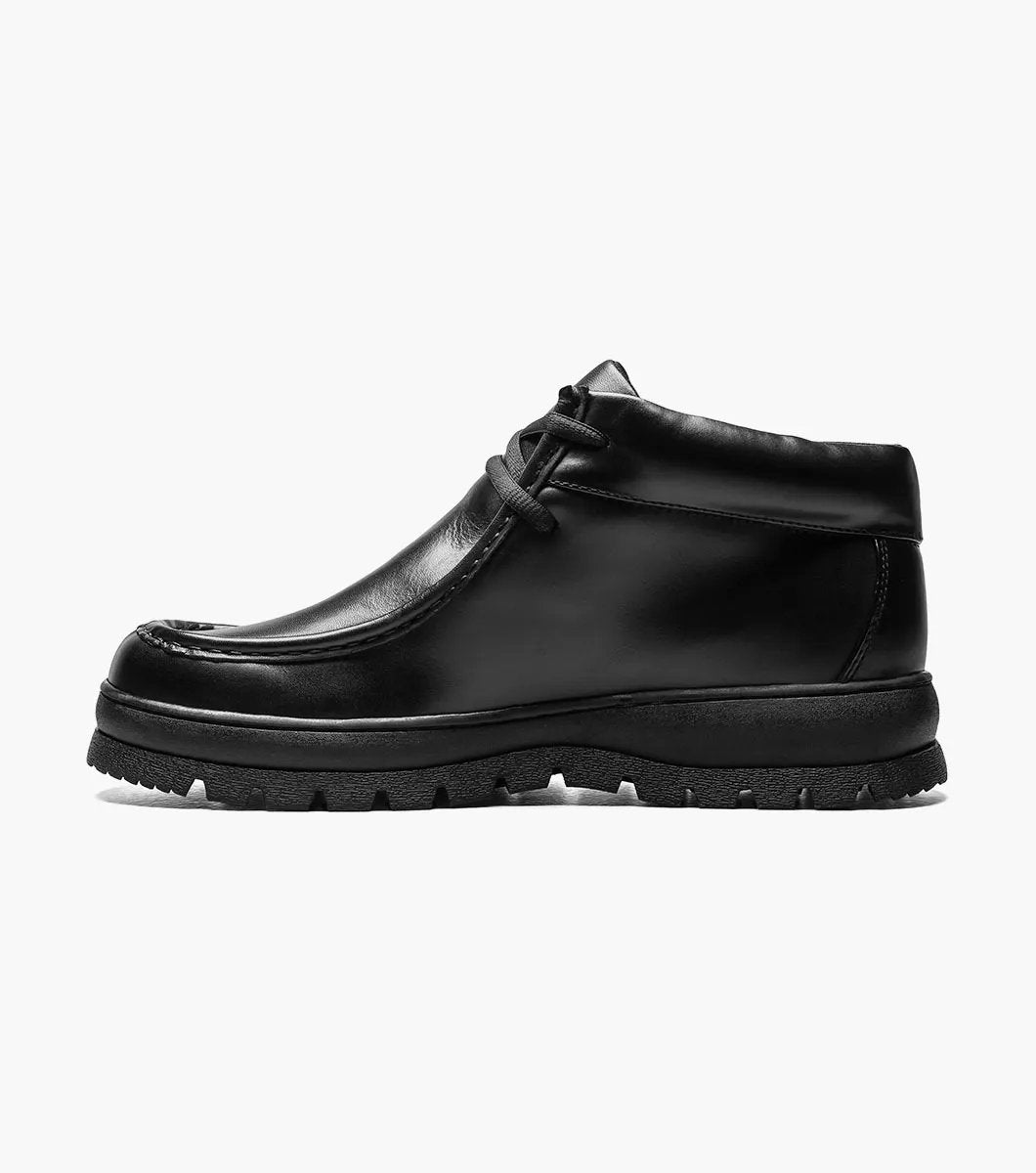 The STACY ADAMS Dublin II Moc Toe Boot (Black Smooth, 63169-57) features a lace-up design, thick textured sole, and classic moc toe style, shown here against a plain white background.