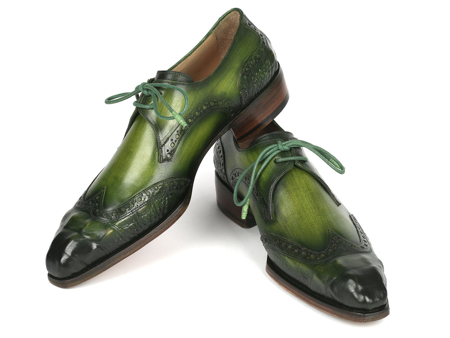 The Paul Parkman Goodyear Welted Wingtip Derby Shoes in Green, model 584-GRN by Paul Parkman, are featured against a white background. These handcrafted shoes, adorned with decorative perforations and laces, combine style and durability as an elegant made-to-order product.