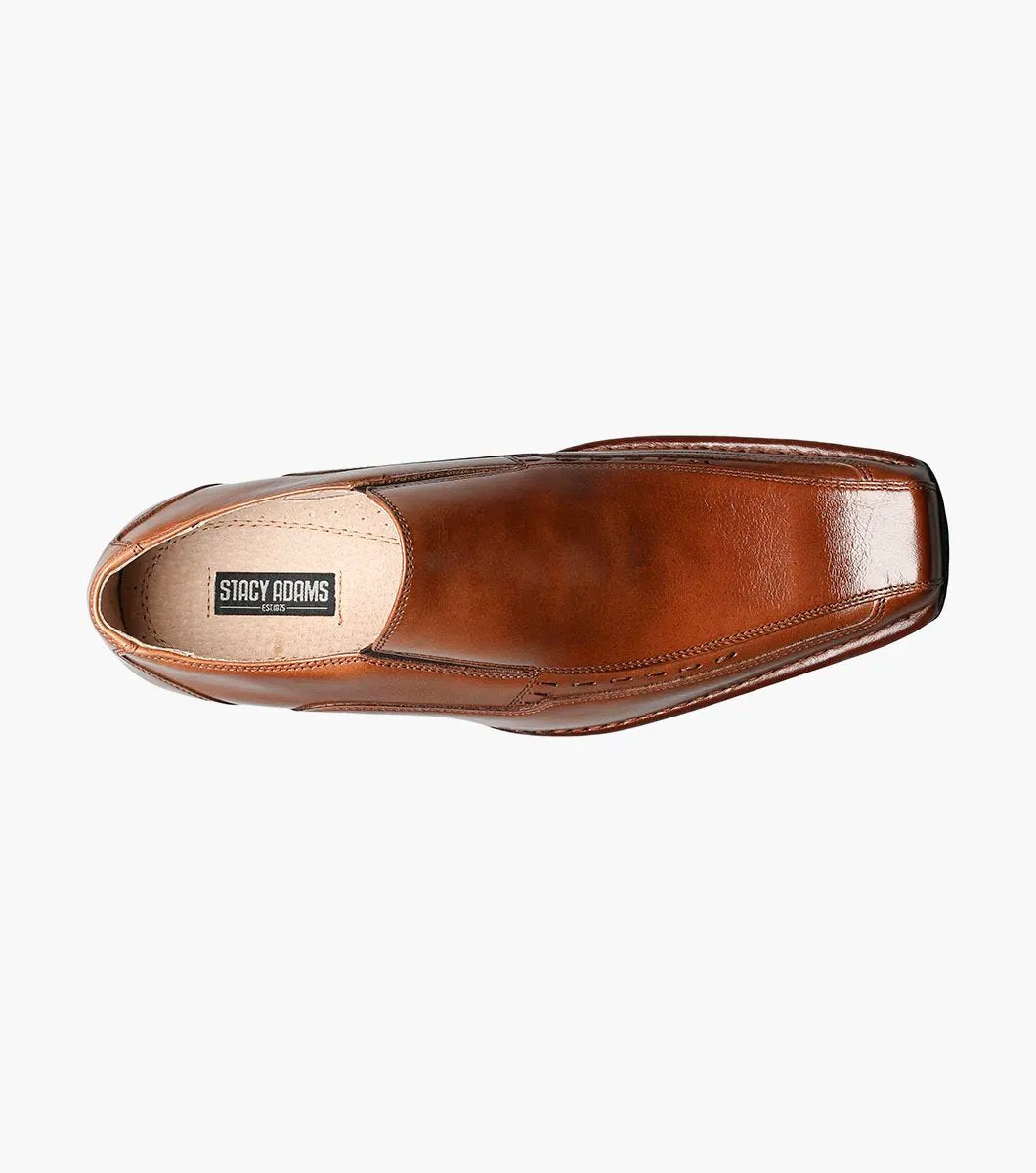 The Stacy Adams Templin Bike Toe Loafer in cognac (24507-221) features brown genuine leather, a pointed toe, low black heel, and decorative stitching—a classic slip-on dress shoe by STACY ADAMS.