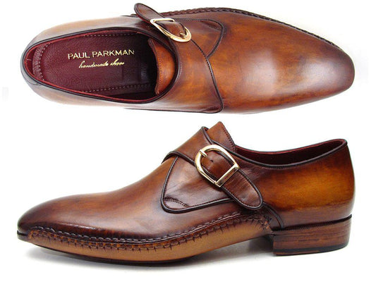 The Paul Parkman Single Monkstraps Brown Leather - 69V5E shoes feature a distinctive buckle, visible stitching, and a low heel. These men's handmade shoes by Paul Parkman highlight exquisite craftsmanship with their hand-painted leather finish.
