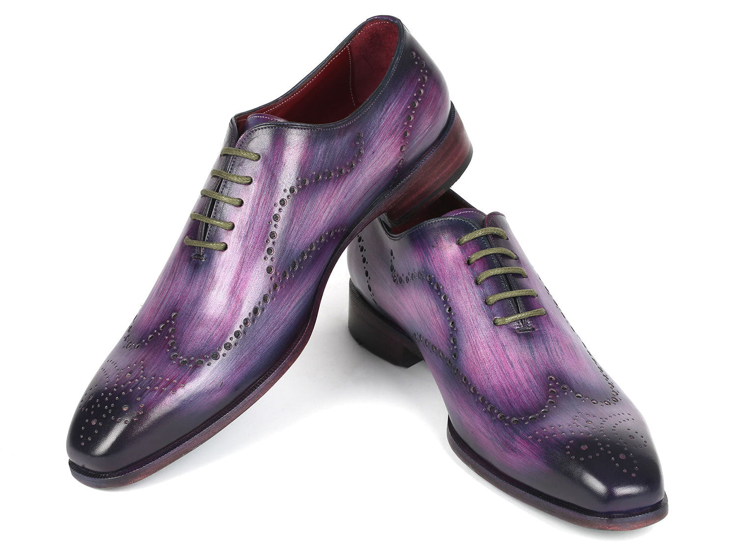 The Paul Parkman Men's Wingtip Oxfords in Purple (741-PUR), crafted to order with decorative perforations and dark laces, elegantly showcase their wingtip design against a white background.