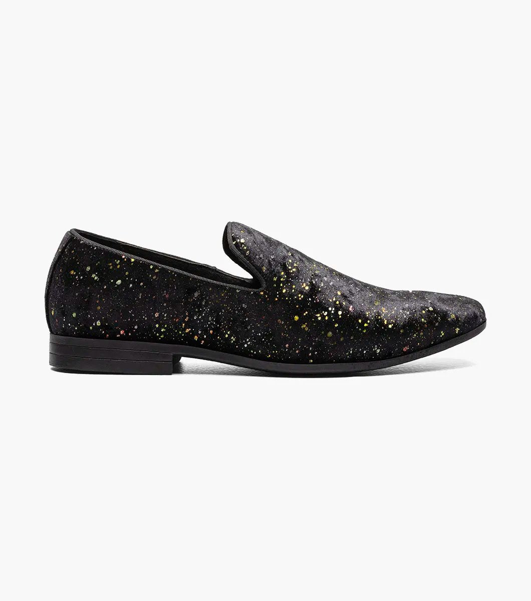 Introducing the Stacy Adams Stellar - STELLAR Plain Toe Glitter Slip On in Black (25534-001). This shoe features a unique multicolored speckled pattern that evokes the beauty of stars. Experience exceptional comfort with its memory foam footbed, ensuring each step feels as if you're walking on clouds.