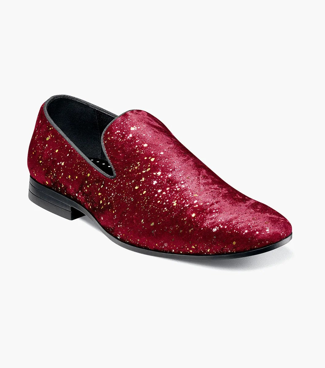 The STACY ADAMS Stellar Plain Toe Glitter Slip On in Burgundy (25534-601) features red velvet with gold glitter, black trim, a low black heel, and a Memory Foam footbed for comfort, shown on a white background.