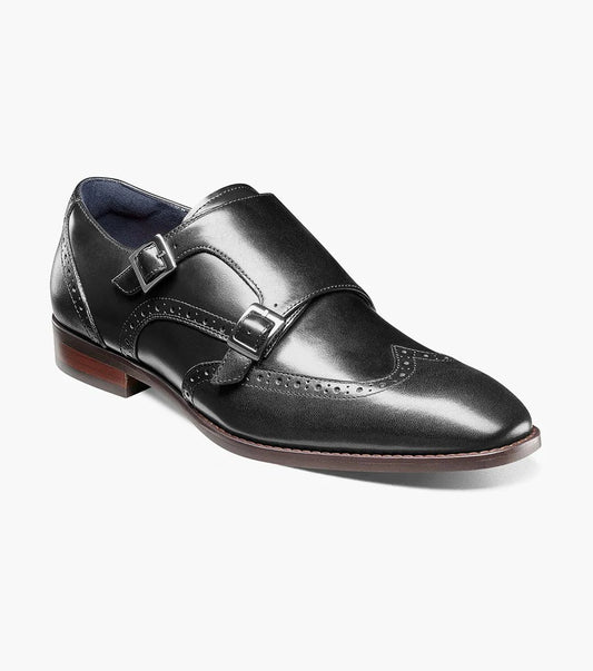 The Stacy Adams KARSON Wingtip Double Monk Strap - Black (model 25570-001) showcases a sophisticated black leather dress shoe with brogue detailing, set against a white background, crafted from premium leather.