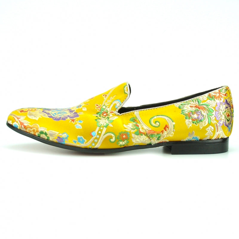 A yellow slip-on Fiesso fashion shoe from the FI-7151 collection by Aurelio Garcia, featuring a vibrant floral and swirl pattern.