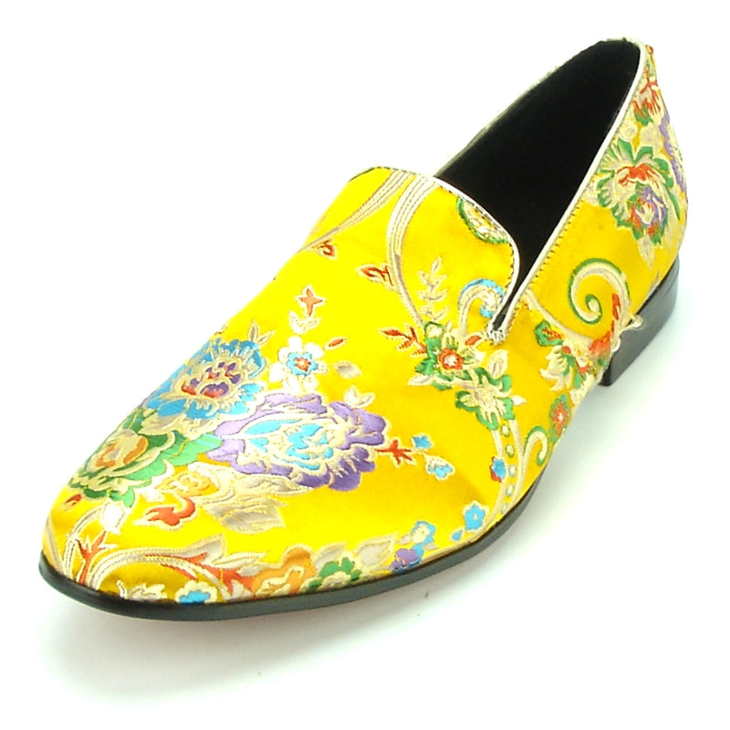 A yellow slip-on Fiesso fashion shoe from the FI-7151 collection by Aurelio Garcia, featuring a vibrant floral and swirl pattern.