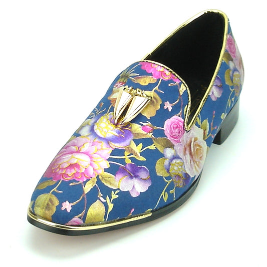 Introducing the FI-7155 Blue Fiesso by Aurelio Garcia: a stunning fashion shoe from Fiesso, showcasing a floral-patterned blue design accented with gold trim and metallic embellishments in shades of pink, purple, and gold. This leather masterpiece is elegantly finished with a chic tassel detail that effortlessly combines sophistication and style.