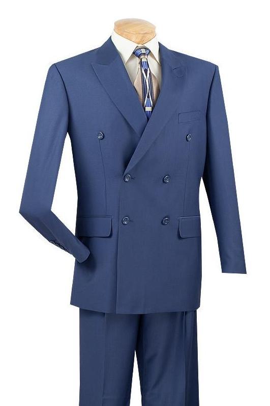 The Vinci Suits Regular Fit Double Breasted 2 Piece Suit (Blue) DC900-1 is elegantly displayed on a mannequin with a beige shirt and geometric patterned tie.
