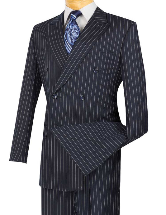 The Regular Fit Double Breasted Stripe 2 Piece Suit (Navy) DSS-4 by Vinci Suits, featuring wide lapels and pleated pants, is elegantly showcased with a white shirt and blue patterned tie on a mannequin.