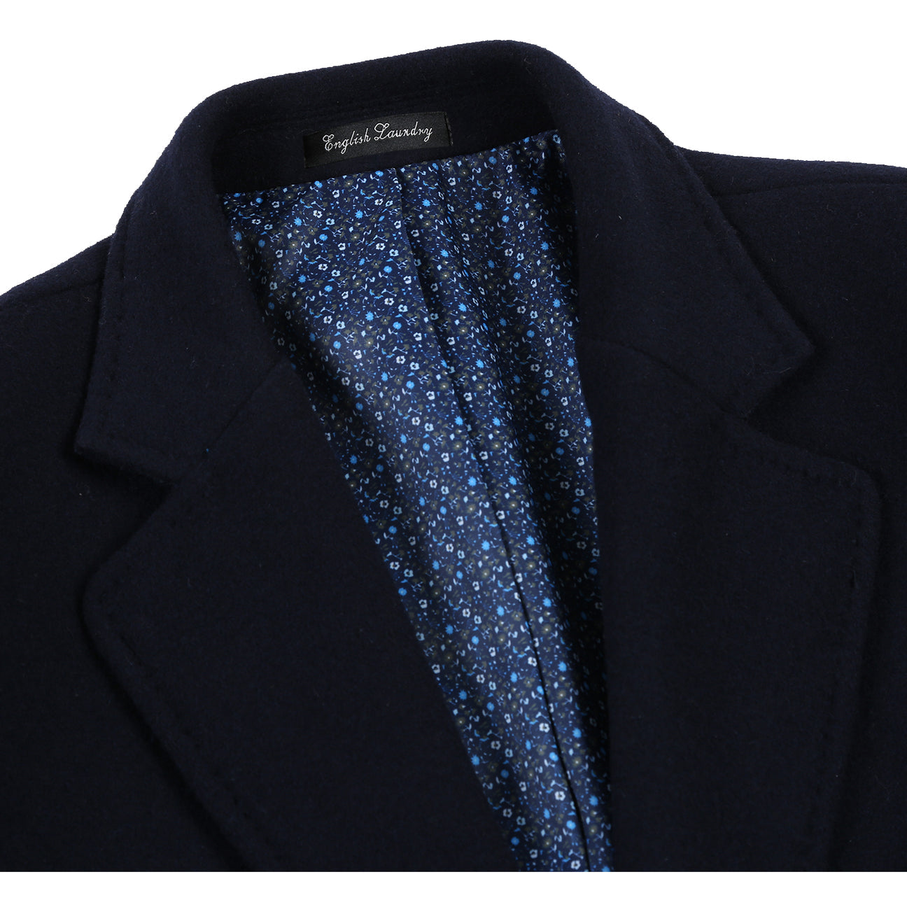 The ENGLISH LAUNDRY Wool Blend Breasted Navy Top Coat EL53-01-410 by English Laundry is a versatile choice that can perfectly complement a black suit jacket, a white shirt, and a black tie with small white dots, creating an elegant layered look suitable for any occasion.