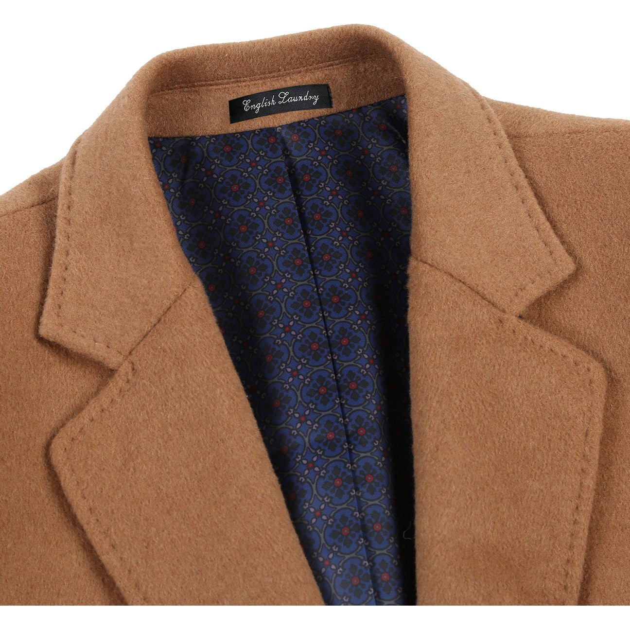 ENGLISH LAUNDRY's Wool Blend Breasted Camel Top Coat EL53-01-600 features a sleek single-breasted design, three buttons, notch lapels, and practical flap pockets. It pairs effortlessly with a crisp white shirt and a sophisticated navy polka dot tie.